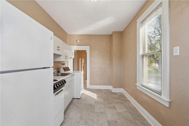 400 Allison Ave, City Of Washington, PA 15301 - kitchen featuring a sink, white appliances, white cabinetry, light countertops, and washer / clothes dryer