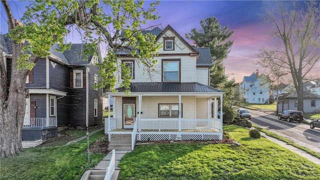 400 Allison Ave, City Of Washington, PA 15301 - victorian home featuring a residential view, a front yard, metal roof, and covered porch