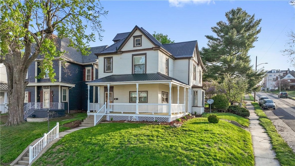 400 Allison Ave, City Of Washington, PA 15301 - victorian-style house with a front yard, metal roof, and covered porch