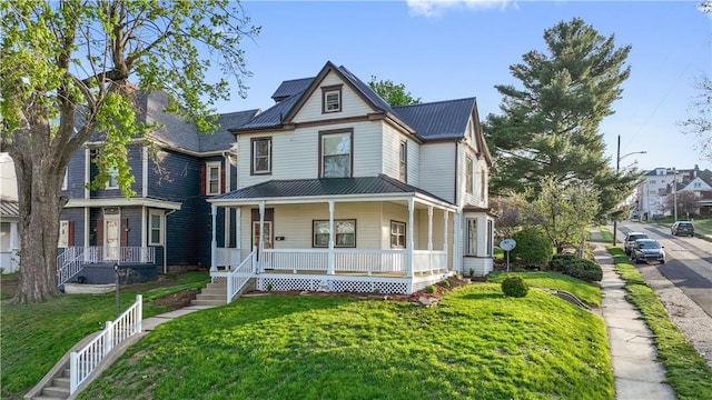 400 Allison Ave, City Of Washington, PA 15301 - victorian-style house with a front yard, metal roof, and covered porch