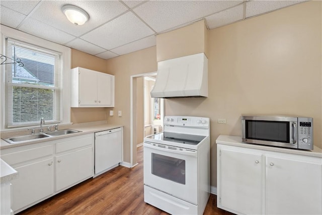 400 Allison Ave, City Of Washington, PA 15301 - kitchen featuring wall chimney range hood, a sink, a drop ceiling, white appliances, and white cabinetry