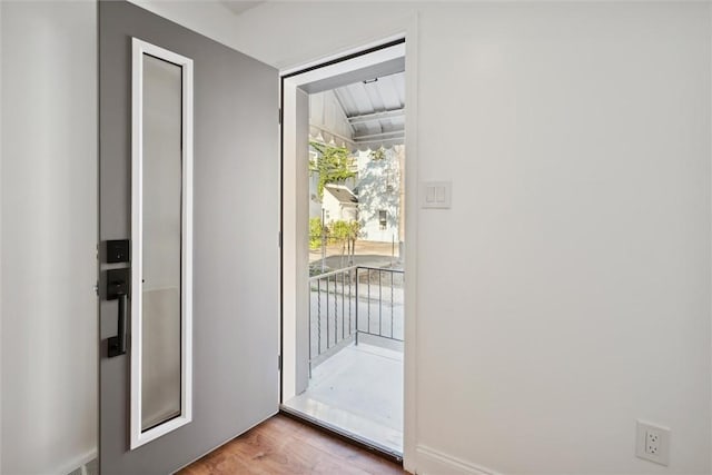doorway to outside featuring wood finished floors