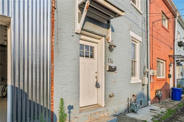 property entrance with brick siding