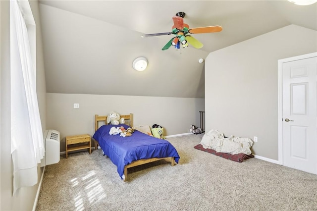 bedroom with carpet floors, ceiling fan, baseboards, and lofted ceiling
