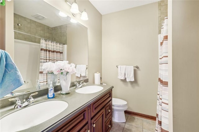 full bathroom with tile patterned flooring, a sink, curtained shower, and toilet