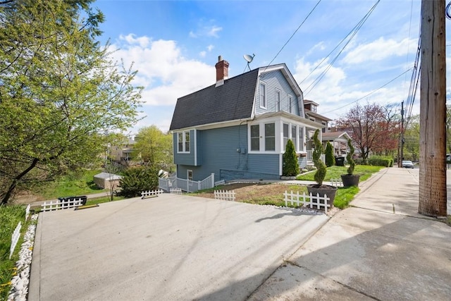 16 Fordham Ave, West View, PA 15229 - view of property exterior with fence, a gambrel roof, a chimney, and roof with shingles