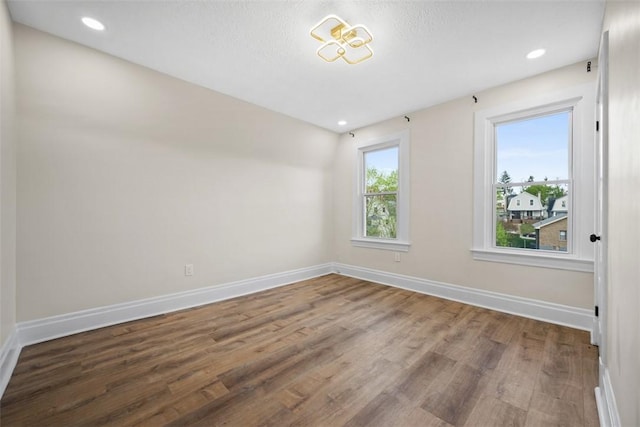 16 Fordham Ave, West View, PA 15229 - unfurnished room with baseboards, wood finished floors, and recessed lighting