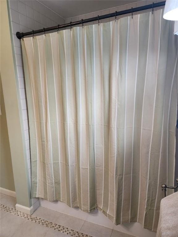 202 Hilltop Dr, Center Twp But, PA 16001 - bathroom with baseboards, tile patterned flooring, and shower / bath combo