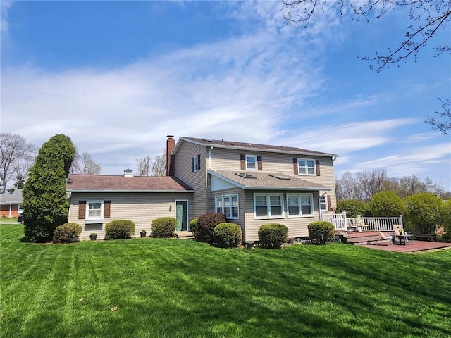 202 Hilltop Dr, Center Twp But, PA 16001 - rear view of house with a wooden deck, a lawn, a patio, and a chimney