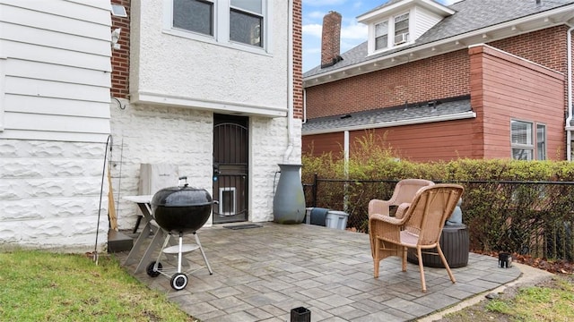 view of patio featuring fence and area for grilling