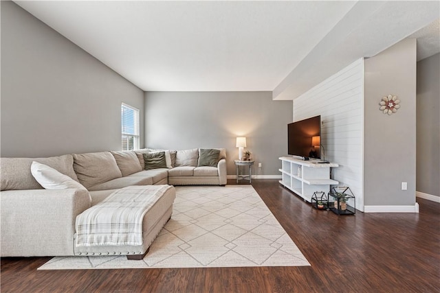 living area with wood finished floors and baseboards