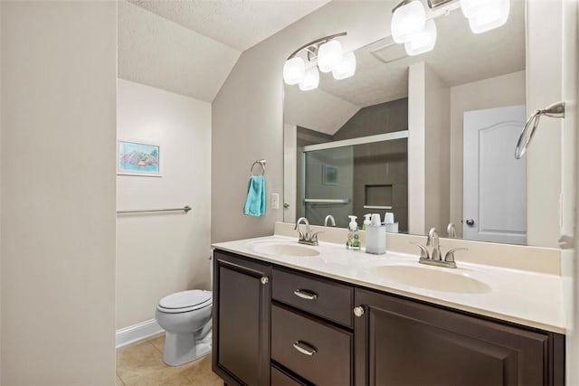 full bath featuring lofted ceiling, a shower stall, toilet, double vanity, and tile patterned flooring