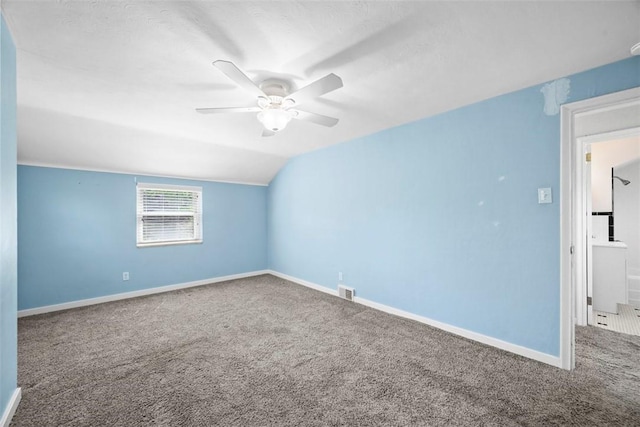 additional living space featuring baseboards, carpet flooring, and ceiling fan