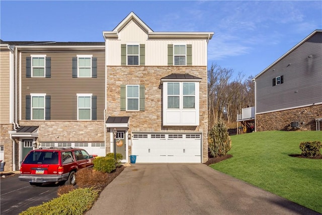 townhome / multi-family property featuring an attached garage, driveway, stone siding, and board and batten siding