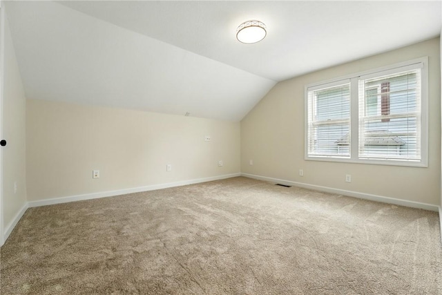 1125 Griswold St, Sharon, PA 16146 - additional living space with visible vents, vaulted ceiling, carpet, and baseboards