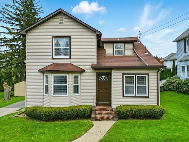 1125 Griswold St, Sharon, PA 16146 - traditional-style home featuring a front lawn and a shingled roof