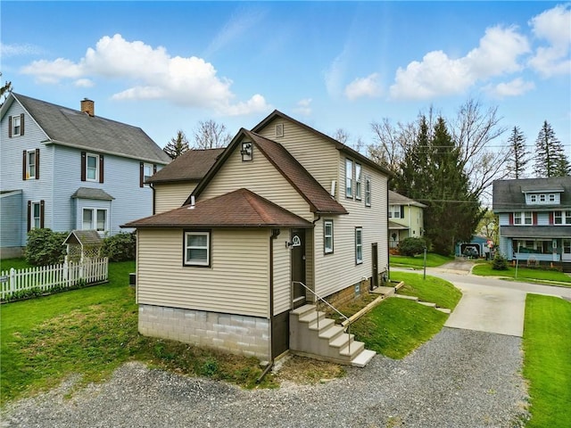 1125 Griswold St, Sharon, PA 16146 - exterior space featuring fence, a yard, entry steps, and a shingled roof