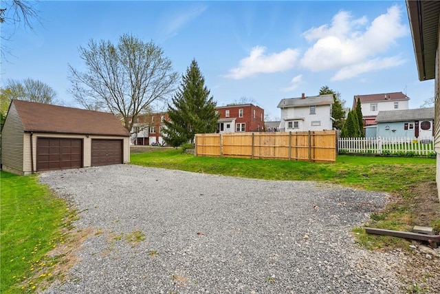 1125 Griswold St, Sharon, PA 16146 - view of yard with fence, an outbuilding, a residential view, and a garage