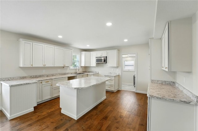 1125 Griswold St, Sharon, PA 16146 - kitchen with baseboards, recessed lighting, stainless steel microwave, a sink, and dark wood-style floors