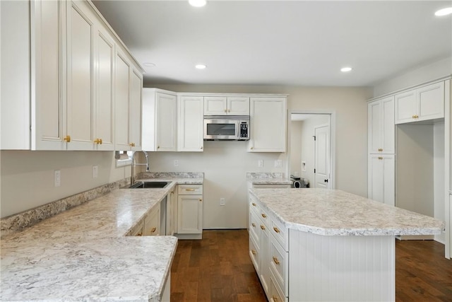 1125 Griswold St, Sharon, PA 16146 - kitchen with stainless steel microwave, recessed lighting, a sink, and light countertops