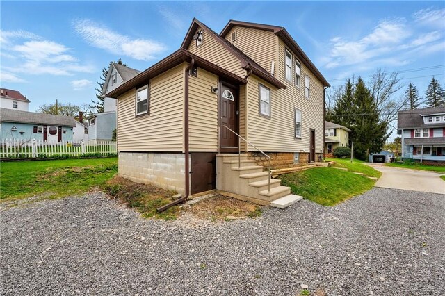 1125 Griswold St, Sharon, PA 16146 - exterior space with fence, entry steps, and a lawn