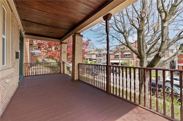 wooden terrace featuring a residential view