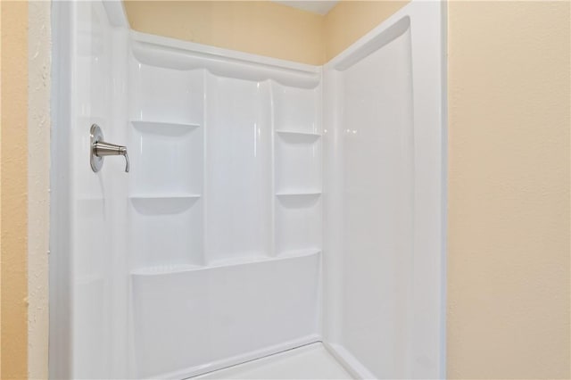 full bathroom featuring walk in shower