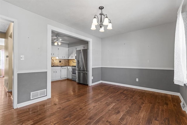 1402 Magnolia Ct, Bethel Park, PA 15102 - unfurnished dining area with dark wood finished floors, visible vents, baseboards, and ceiling fan with notable chandelier