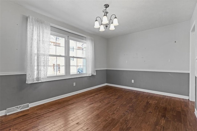 1402 Magnolia Ct, Bethel Park, PA 15102 - spare room featuring hardwood / wood-style floors, visible vents, baseboards, and a notable chandelier