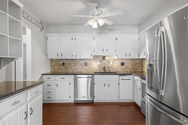 1402 Magnolia Ct, Bethel Park, PA 15102 - kitchen with stainless steel appliances, a sink, dark wood finished floors, dark countertops, and ceiling fan
