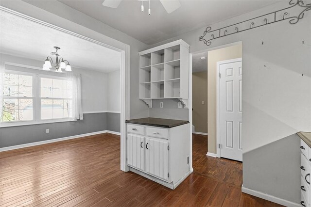 1402 Magnolia Ct, Bethel Park, PA 15102 - kitchen featuring white cabinets, dark countertops, open shelves, and dark wood-type flooring