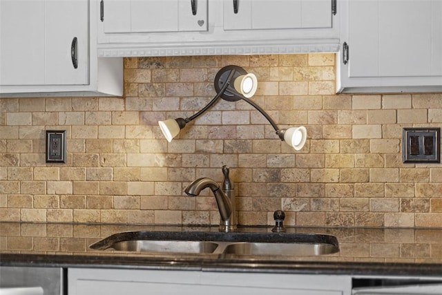 1402 Magnolia Ct, Bethel Park, PA 15102 - kitchen with white cabinets, dark countertops, decorative backsplash, and a sink