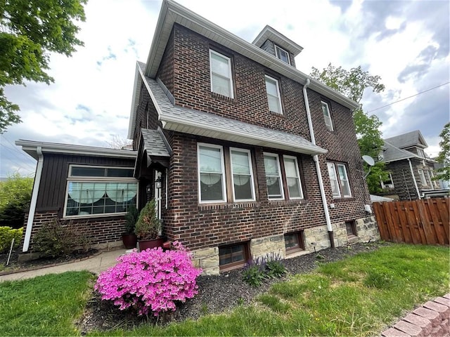 129 S Braddock Ave, Point Breeze, PA 15221 - view of home's exterior with brick siding and fence