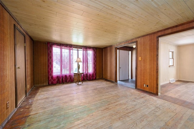 829 Fellsburg Rd, Rostraver, PA 15012 - spare room with wood walls, wooden ceiling, visible vents, and wood-type flooring
