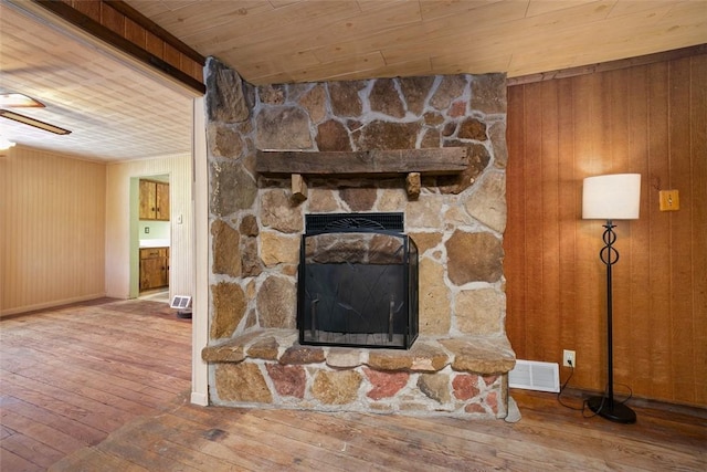 829 Fellsburg Rd, Rostraver, PA 15012 - interior details featuring wooden walls, a ceiling fan, wood finished floors, and visible vents