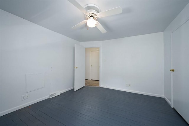 829 Fellsburg Rd, Rostraver, PA 15012 - unfurnished room with visible vents, baseboards, and dark wood-style flooring