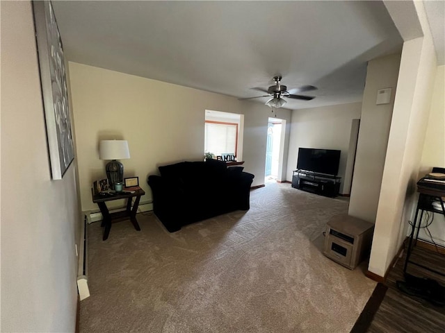 carpeted living area featuring baseboards and ceiling fan