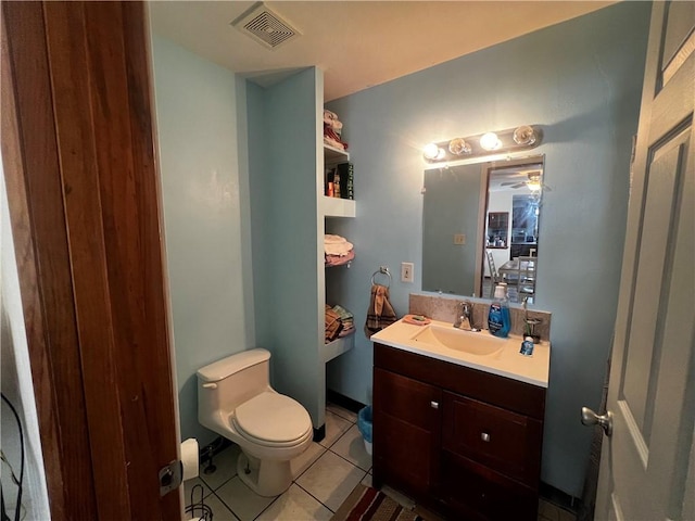 bathroom with visible vents, tile patterned flooring, vanity, and toilet