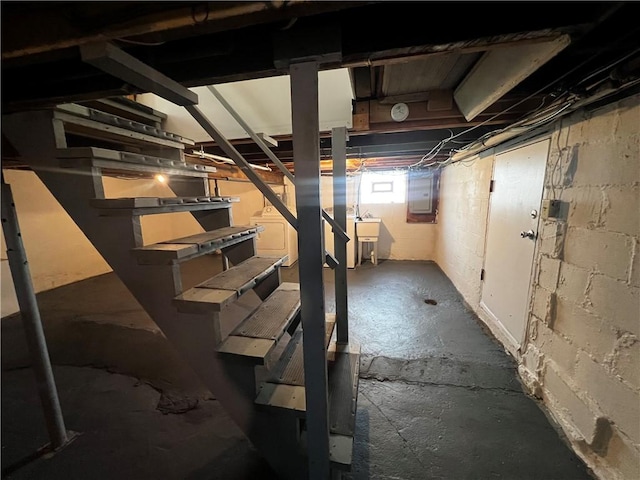 below grade area with stairs and electric panel