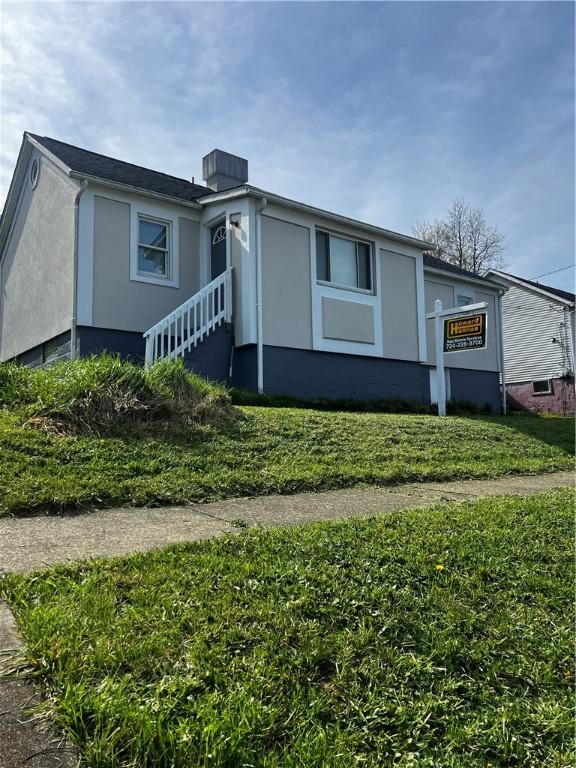 view of front of home featuring stucco siding