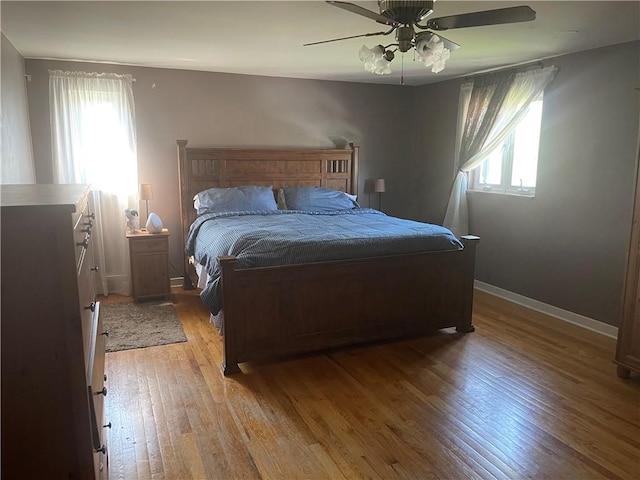 4710 Doverdell Dr, Whitehall, PA 15236 - bedroom with light wood finished floors, baseboards, and a ceiling fan