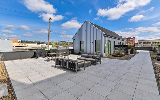 view of patio featuring outdoor dining area and an outdoor living space