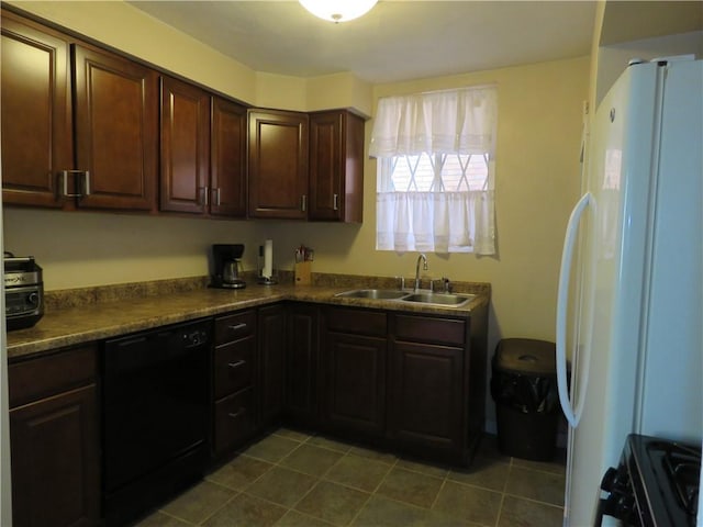 kitchen with tile patterned floors, a sink, dark countertops, dark brown cabinetry, and black appliances
