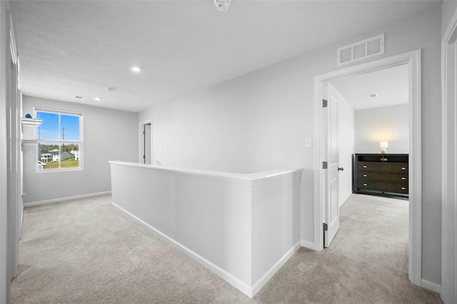 167 Alta Vista Dr, Imperial, PA 15126 - hall with carpet floors, visible vents, baseboards, and an upstairs landing