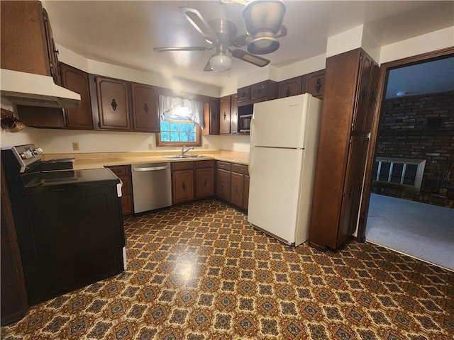 kitchen featuring dark brown cabinets, stainless steel dishwasher, black / electric stove, and freestanding refrigerator