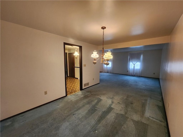 unfurnished dining area with a notable chandelier and carpet flooring