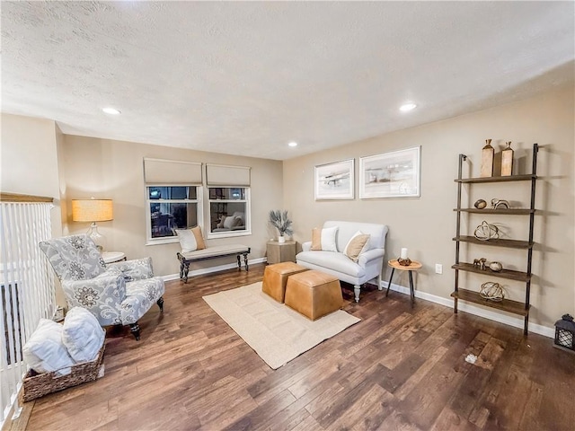 living room with wood finished floors, recessed lighting, and baseboards