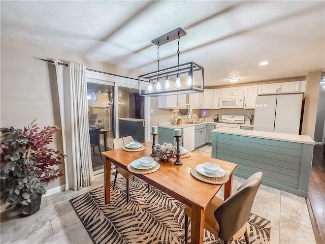 dining area featuring recessed lighting