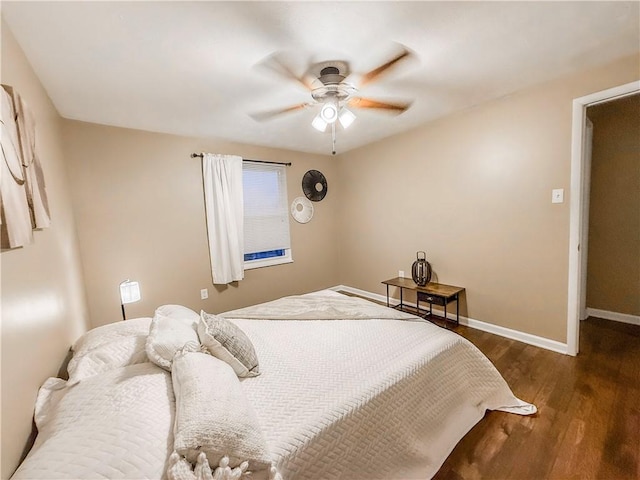 bedroom with wood finished floors, ceiling fan, and baseboards