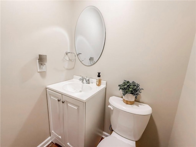 bathroom featuring toilet and vanity